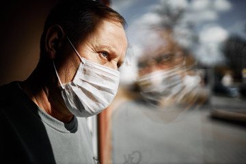 Wall Mural - Elderly man in a white mask