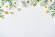 © Zamurovic Brothers - Creative layout made with colorful  flowers and Easter eggs. Minimal nature background. Spring holidays concept.