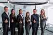 © newagecinema - Group of thumbing up business people. Concept of teamwork and cooperation