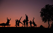 silhouettes of people on a sunset