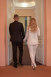 © Dubnytskaya Photo - young couple newlyweds from the back after painting