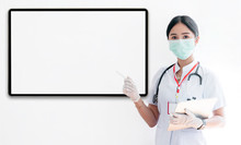 Young Female Doctor Or Nurse Holding Tablet And Pointing At Banner.