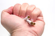 © savcoco - Hand crushing cigarettes
