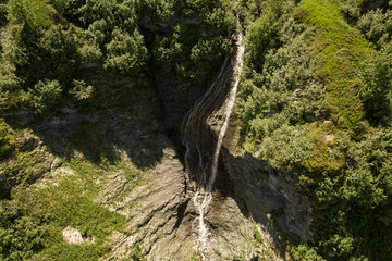 Wall Mural - Aerial view of brook with waterfall in the French Alps