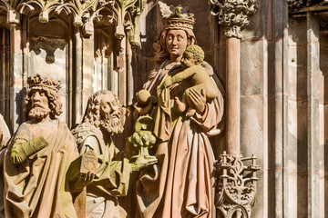 Wall Mural - the portal Saint-Laurent is adorned with a group of statues of the martyrdom of the saint on the cathedral of Strasbourg, France