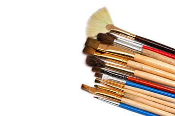 different brushes for painting on a white background