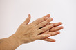rubbing hands isolated on white background