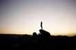 © Nate & Amanda Howard/Stocksy - Silhouettes at sunset in Joshua Tree national park.