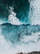 Aerial Drone View Of Spashing Waves In Blue Ocean