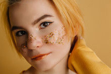 Girl With Yellow Stars Like Freckles On Her Cheeks