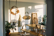 © Melissa Milis Photography/Stocksy - an arty studio space with table, swing and sunshine