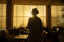 Anonymous Woman In Hotel Restaurant
