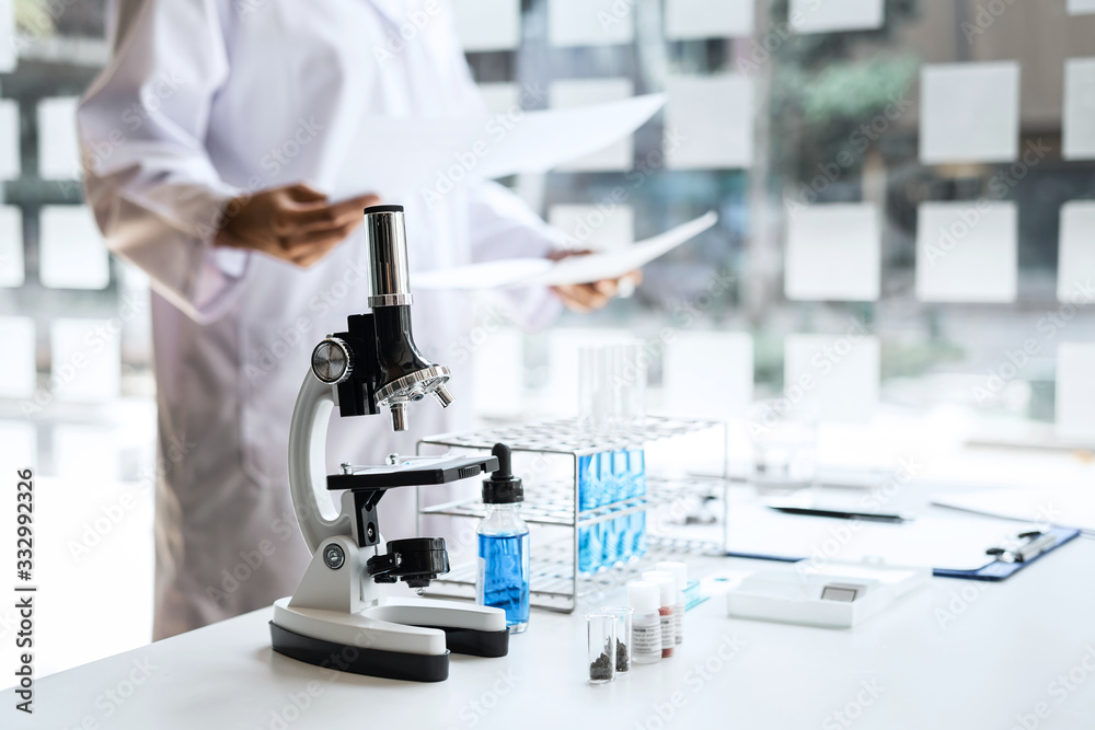 Biochemistry laboratory research, Chemist is analyzing sample in ...