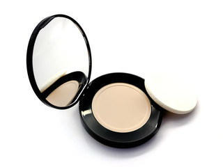 Face powder and sponge isolated on white background. Cosmetic powder. Powder with a mirror. Face cosmetics. Foundation for makeup. Makeup powder. Cosmetics. 