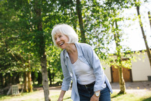 Laughing Mature Woman Outside In Nature.
