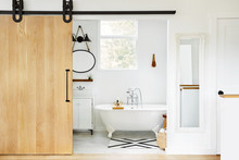 Modern design farmhouse bathroom with clawfoot tub