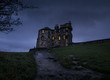 © Tod Kapke/Stocksy - Scenic view of old castle at dusk