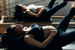 © MaaHoo Studio/Stocksy - Pregnant woman practicing pilates with equipment reformer