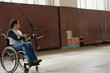 © Clique Images/Stocksy - Professional Female Archer On Wheelchair