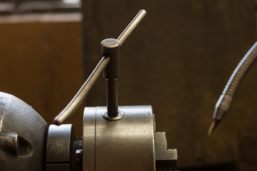 Finishing metal working internal steel surface on lathe grinder. Metalworking industry