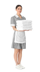 Poster - Young chambermaid holding stack of fresh towels on white background