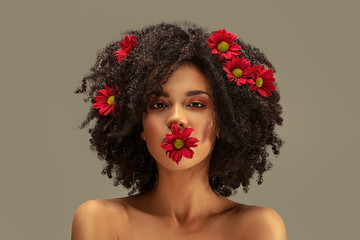 Wall Mural - Beauty afro girl with flowers in hair.