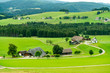 Pleasing landscape of hills, forest, grass, and farm; idyllic scenery in Germany, Europe