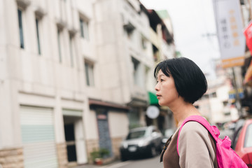 Canvas Print - walking Asian traveling woman