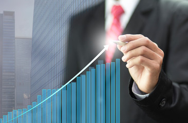 Businessman drawing graph chart to planing business growth success