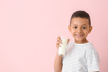 Poster - African-American boy with milk on color background