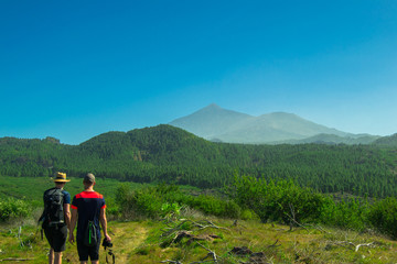 photographers practicing hiking in the municipality of santiago del teide, tenerife.