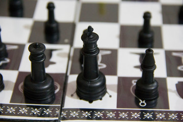 Close-up of a king black chess piece on chess board. Plan leading strategy of successful business competition leader concept. Copy space for your text.