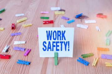 Poster - Writing note showing Work Safety. Business concept for policies and procedures in place to ensure health of employees Colored clothespin papers empty reminder wooden floor background office