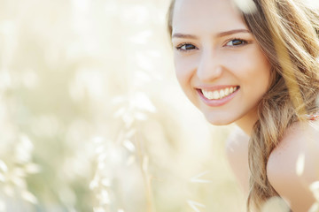 Beautiful woman. Portet of a beautiful smiling woman on nature.