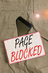 Fototapete - Text sign showing Page Blocked. Business photo showcasing Users are prevented from being accessed or used the webpage Smartphone device inside formal work trousers front pocket near note paper