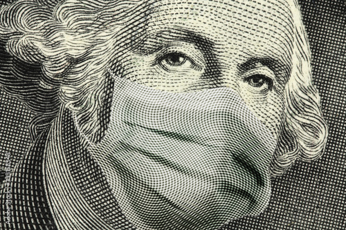 COVID-19 coronavirus in USA, Close up of ONE Dollar money bill with George Washington wearing healthcare surgical mask. Quarantine and global recession. Global economy hit by Covid19.