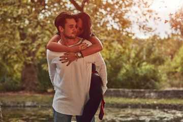 Wall Mural - Couple in love hugging and kissing outdoors. Love concept.