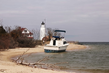 a beached boat at cove point lighthouse in lusby, maryland