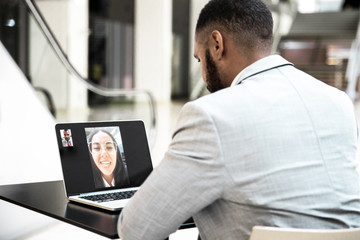 businessman talking to colleague through video call. business man using digital devices for video ch