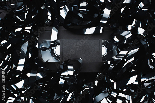 Fotomural top view of black VHS cassette in film strip
