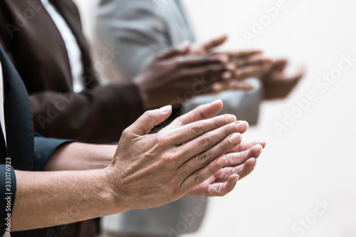 Cuadros en Lienzo Hands of business colleagues applauding speaker