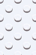 © daarnautova - Medical seamless monochrome pattern made with round pills,tablets or vitamins on white background top view.Medicine health minimalistic abstract concept.Photography collage