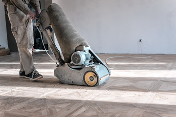 Wall Mural - worker with professional grinding machine