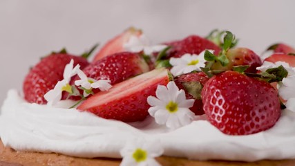 Canvas Print - Strawberry cake, strawberry sponge cake with fresh strawberries and sour cream on a kitchen countertop.