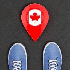 Poster - Travel to Canada Concept. Blue Denim Sneakers on the Asphalt Road with Map Pointer and Canada Flag Top View. 3d Rendering