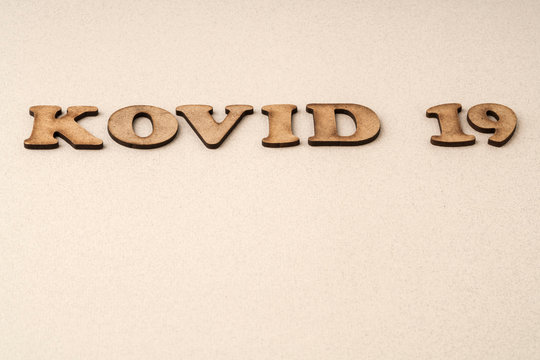 Epidemic corona virus covid 19 written with carved wooden letters in Turkish. Kovid means covid in Turkish..