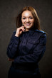 © DSMT - portrait of a beautiful girl in police uniform. Professional posing
