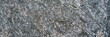 The background is solid gray granite as a screensaver or wallpaper.