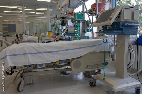 Medical ventilator and bed  in intensive care unit in hospital,  a place where can be  treated patients with pneumonia caused by coronavirus covid 19.