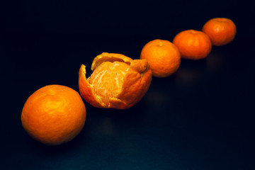 Tangerines on a black background